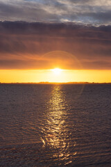 Beautiful View of colorful cloudscape over the ocean during dramatic sunset. Taken in White Rock, Vancouver, British Columbia, Canada.