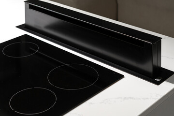 Modern black induction stove with ventilation system