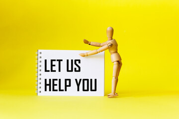 Let us work for you . Text on a notebook, next to a wooden doll on a yellow background.