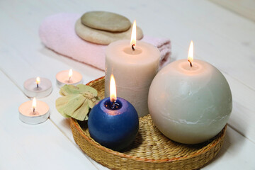 Fototapeta na wymiar Candles, towel and stones