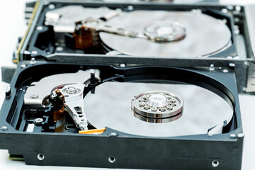 Open hard disk drives close up. Information, data storage infrastructure cost concept