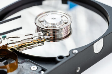 Open hard disk drive close up. Information, cloud data storage, infrastructure cost concept