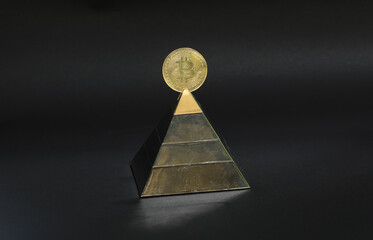 financial pyramid with bitcoin on a black background