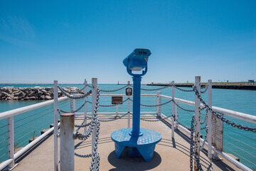 Blue Standing Tower Viewer Binoculars Looking Out to Lake Michigan and Clear Blue Sky