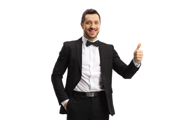 Elegant man in a suit and bow showing thumbs up