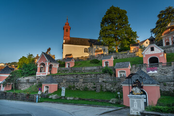 Fototapeta na wymiar Kalvarienbergkirche church with many of chapels on small hill in summer morning