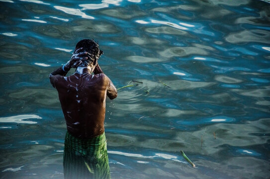 A Man Bath In The Oily River