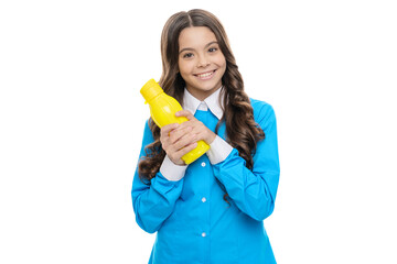 Happy child hold yellow plastic bottle with vegetarian liquid food for breakfast, smoothie
