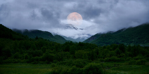 Digital art. Natural landscape with fog and mystical planet or moon.