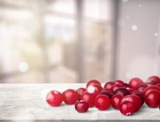 Tasty juicy ripe red cranberries on a desk