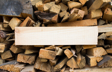 Wall firewood. Background of dry chopped firewood logs in a pile