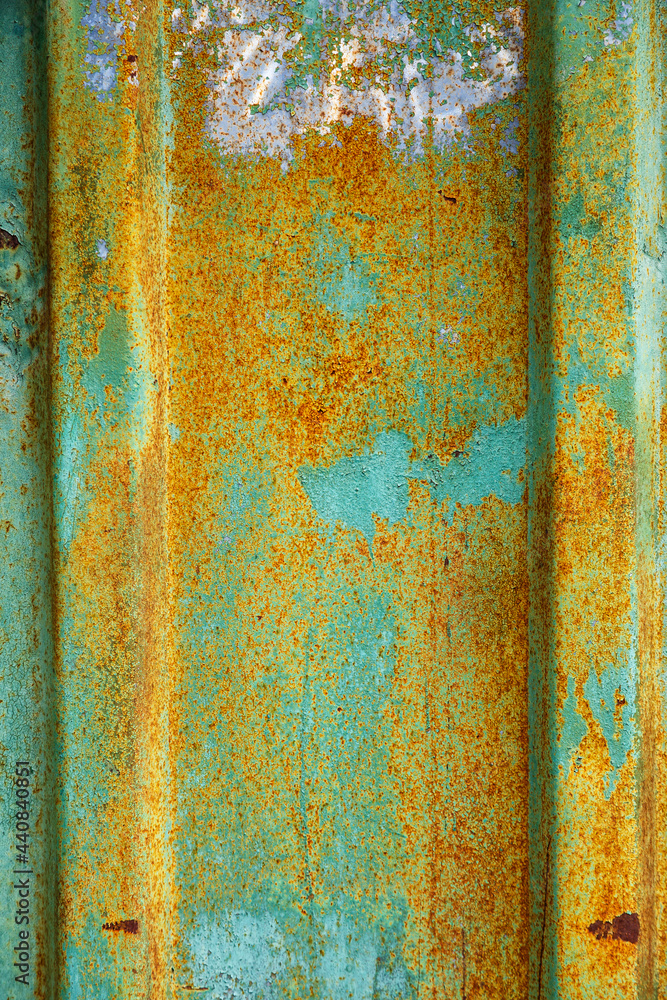 Wall mural background of peeling paint and rusty old meta. little black dots and scratches. corrosion of metal,