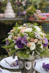 Party decoration with purple and white flowers