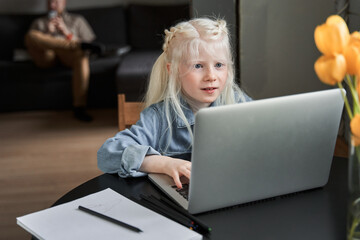 Girl stuck with hard task, preparing homework at home at the self isolation
