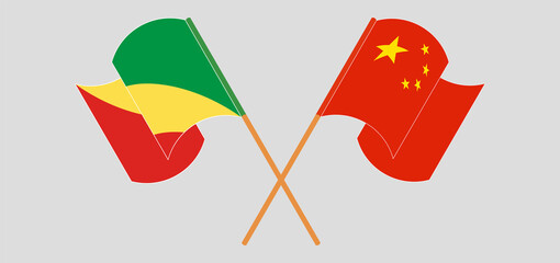 Crossed and waving flags of Republic of the Congo and China