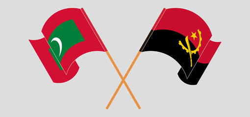 Crossed and waving flags of Maldives and Angola - obrazy, fototapety, plakaty