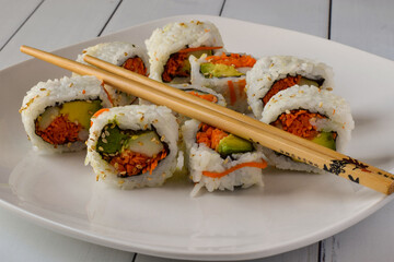 garden roll sushi arranged on a plate