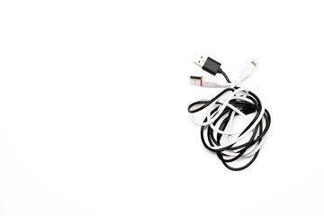 tangled usb wires from the phone on a white background