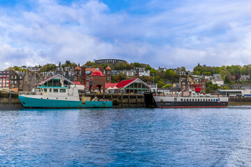 Fototapeta na wymiar A view from a boat towards the landing at Oban, Scotland on a summers day
