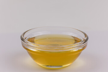 glass bowl with fresh golden liquid honey