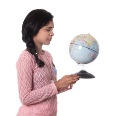 Fototapeta premium Beautiful Girl holding a world globe isolated on a white background