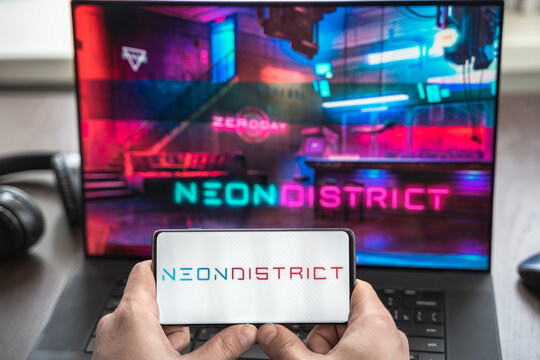 Russia Moscow 30.05.2021.Logo,screenshot of blockchain nft ethereum cryptocurrency kiber punk game Neon District in laptop, mobile phone. Man playing, collecting cards. Earning tokens,digital money