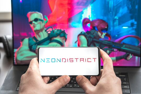 Russia Moscow 30.05.2021.Logo,screenshot of blockchain nft ethereum cryptocurrency kiber punk game Neon District in laptop, mobile phone. Man playing, collecting cards. Earning tokens,digital money