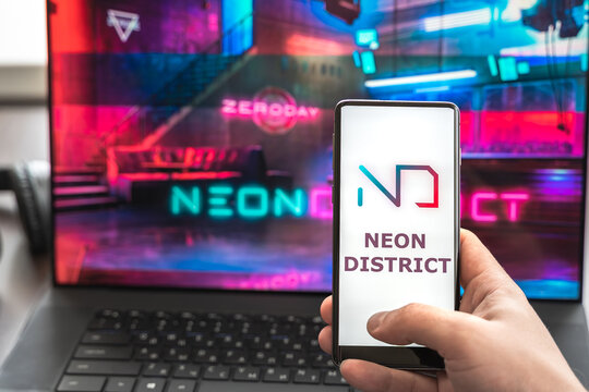 Russia Moscow 30.05.2021.Logo,screenshot of blockchain nft ethereum cryptocurrency kiber punk game Neon District in laptop, mobile phone. Man playing, collecting cards. Earning tokens,digital money