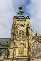 Fototapeta na wymiar Fragment of Saint Vitus Cathedral - Gothic Roman Catholic cathedral in Prague Castle, seat of the Prague Archbishop. Prague, Czech Republic. 