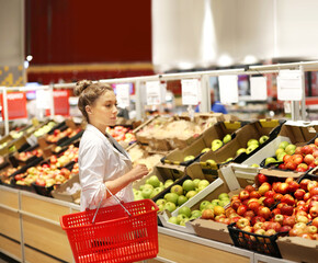 Woman buying fruits and vegetables at the market