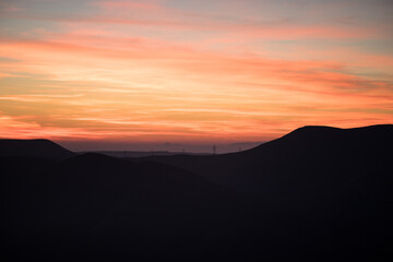Fototapeta na wymiar Colorful sunset over the mountain hills. Beautiful landscape in Azerbaijan nature.
