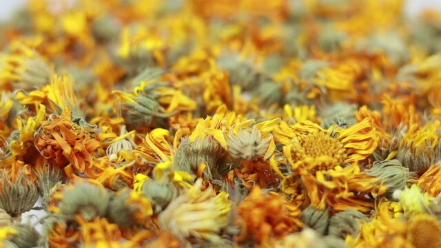 Rotating dry calendula flowers - close up view.