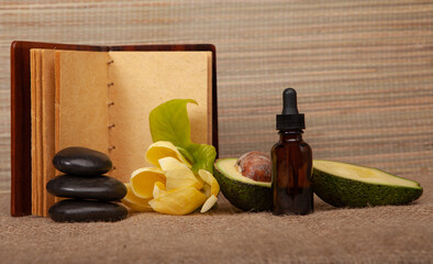 Stones, avocado,nd old book. Spa concept.