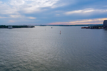 Aerial view of on Brooklyn large and spectacular buildings and seaports in financial district over Hudson River near Manhattan skyline