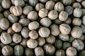 a close-up walnut counter in a farmer's market