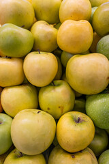 Fresh ripe apples on the counter of a farm shop