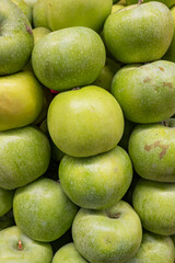 Fresh ripe apples on the counter of a farm shop