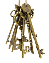 old brass key against a white background
