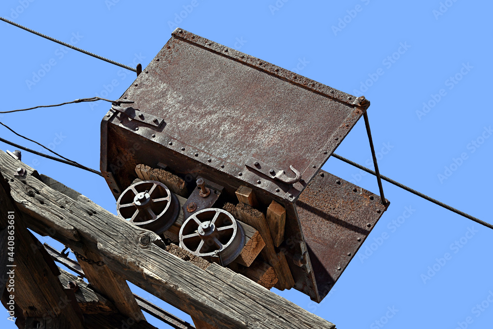 Wall mural antique coal car high up on the tracks