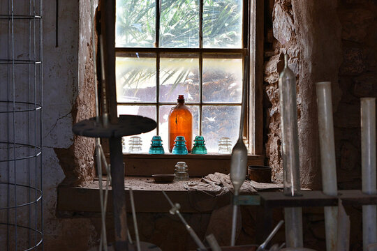 Looking out an old workshop window.