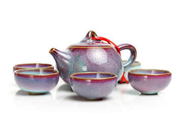 An image of a teapot and teacups on white background