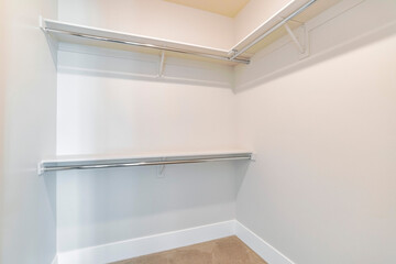 White wooden shelves and racks in the pantry or wardrobe room