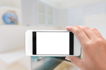 The hand is holding the white screen mobile phone