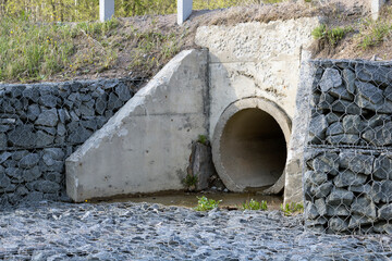Street outdoor sewerage, concrete pipe. Sewer drains - obrazy, fototapety, plakaty
