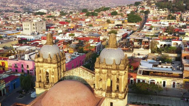Aerial View of Oaxaca City Downtown, Historic Center and Santo Domingo de Guzman Church on Golden Hour Sunlight, Mexico. Drone Shot
