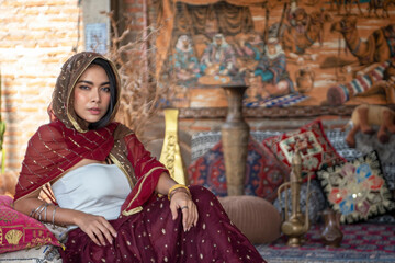 Asian woman attractive model dressed in posh, gildet, indian costume