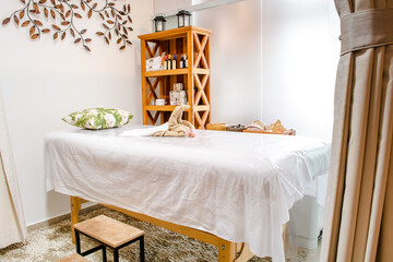 spa setting, with bed for relaxing massage appointments