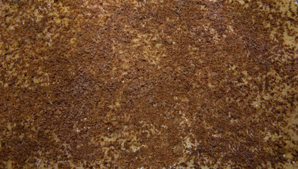 Sweet dessert background. Top closeup view of a creamy cake with caramel and grated chocolate. 