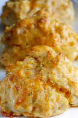 Cheddar cheese biscuits in a row