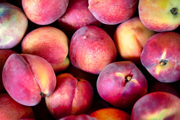A close up of ripe peaches.
